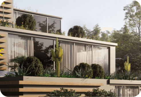 Contemporary single-storey home with floor-to-ceiling glass walls and white render facade, featuring horizontal timber deck in foreground and drought-tolerant landscaping with cacti and native plants against a soft misty backdrop.